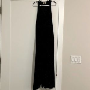 Jersey knit racer back maxi dress with front slit. Cinched elastic waist.